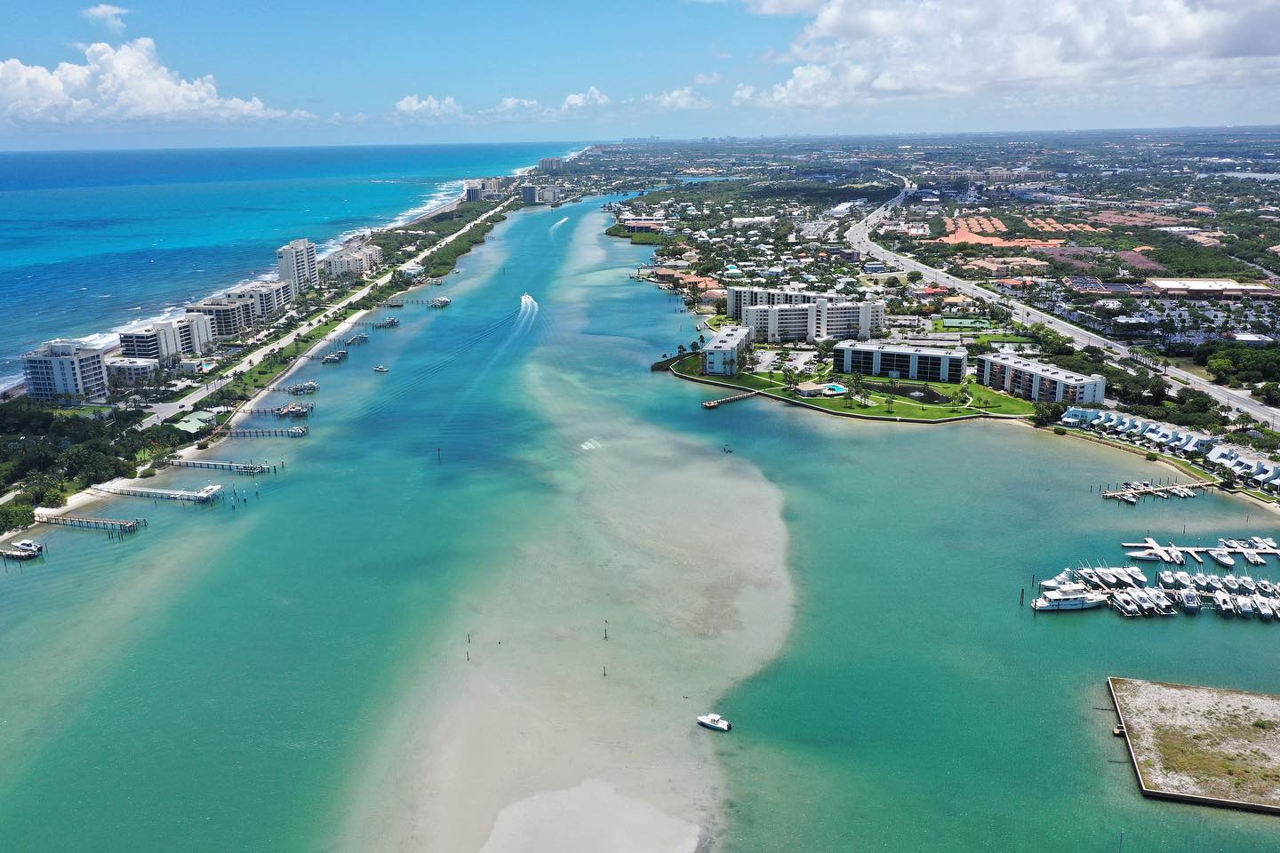 61274698_1004545223086478_7168155921439260672_o a large body of water with a city in the background