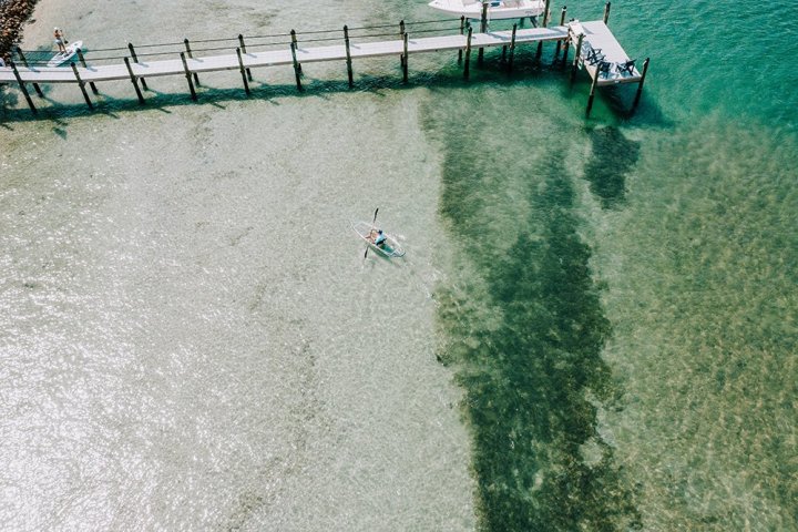 a person riding a surfboard in the water