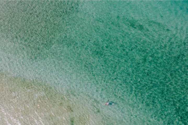 a man riding a wave in the ocean