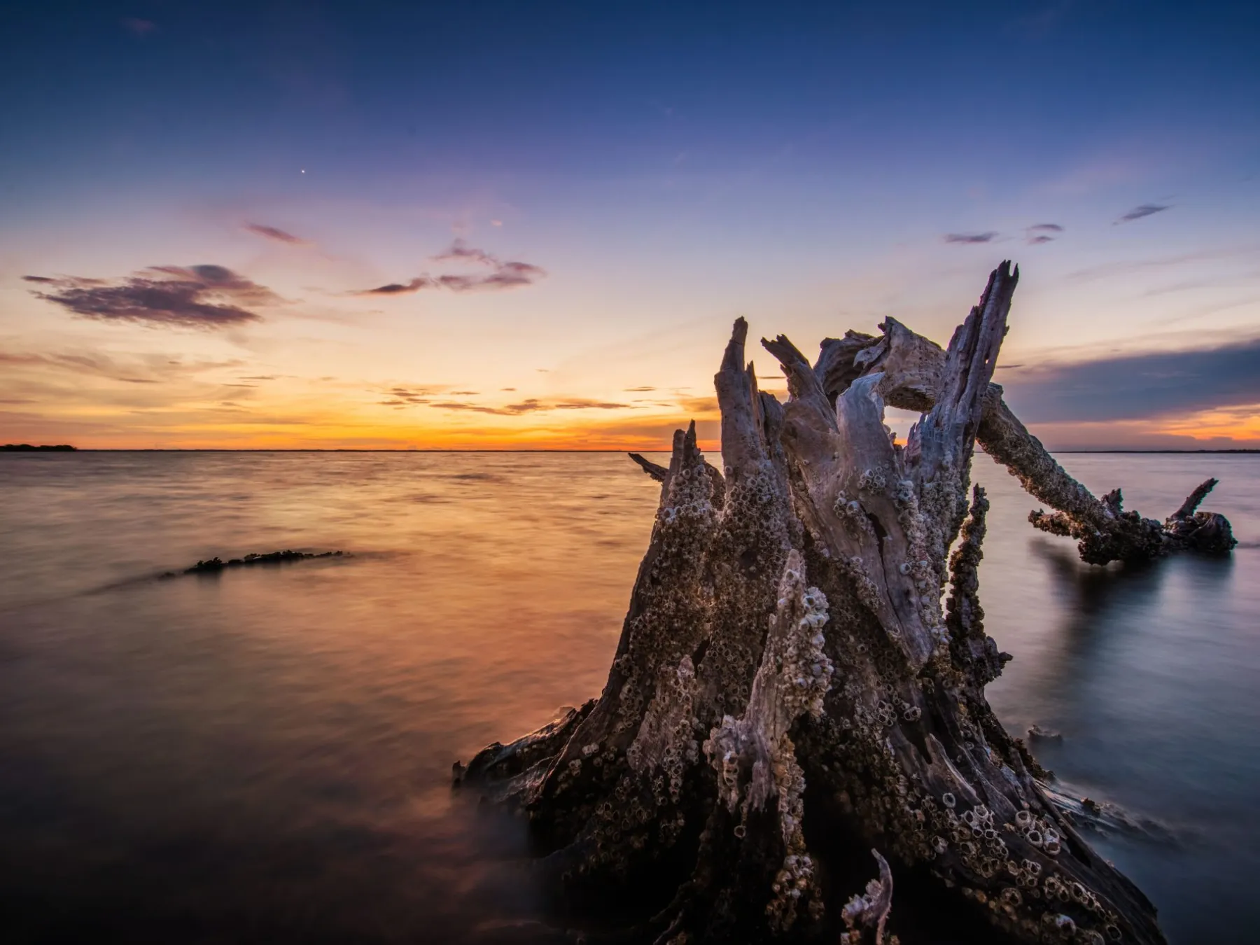 a sunset over a body of water
