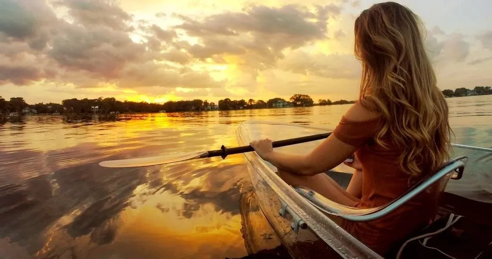 a person sitting in front of a body of water