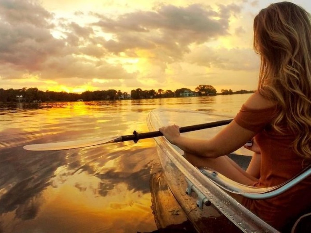 a person sitting in front of a body of water