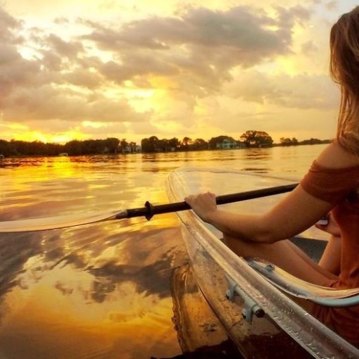 a person sitting in front of a body of water