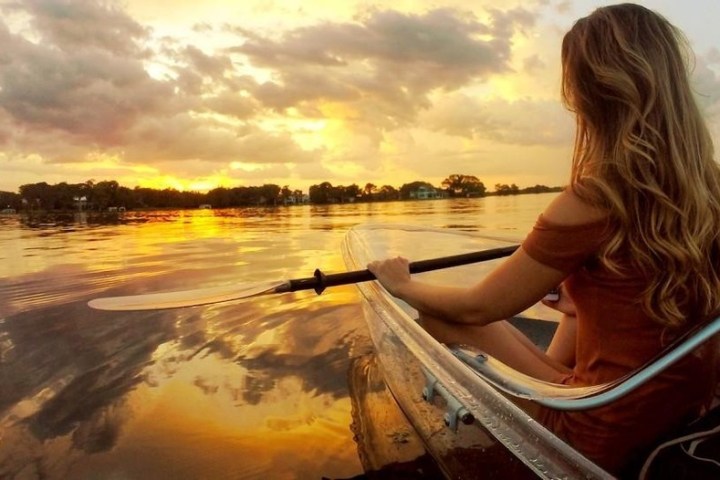 a person sitting in front of a body of water