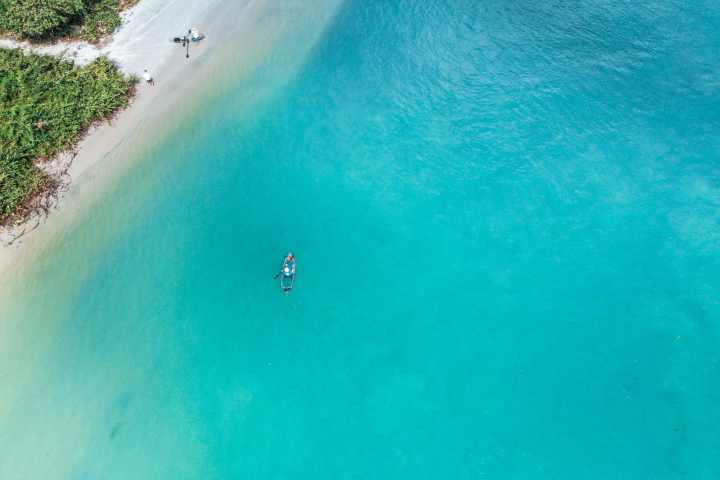 a group of people in a pool of water