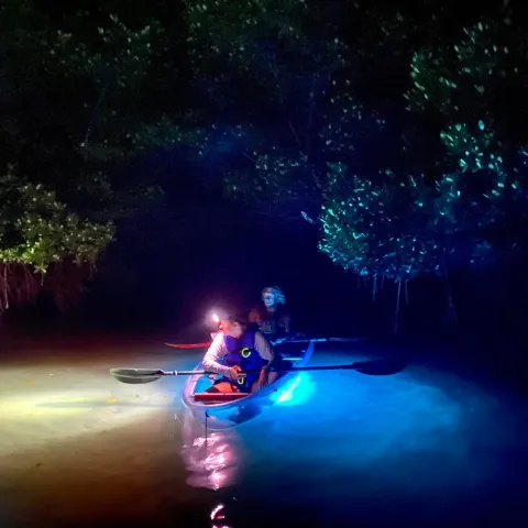 a person riding a motorcycle in the water