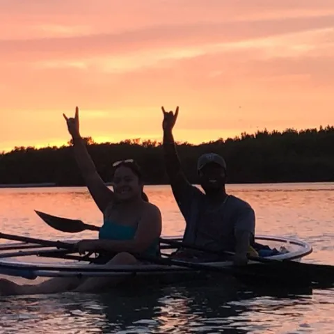 a man rowing a boat in a body of water