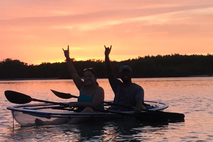 a man rowing a boat in a body of water