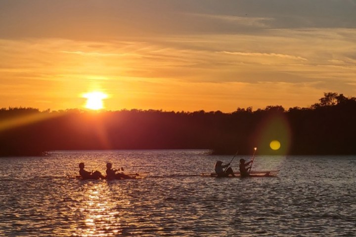 a sunset over a body of water
