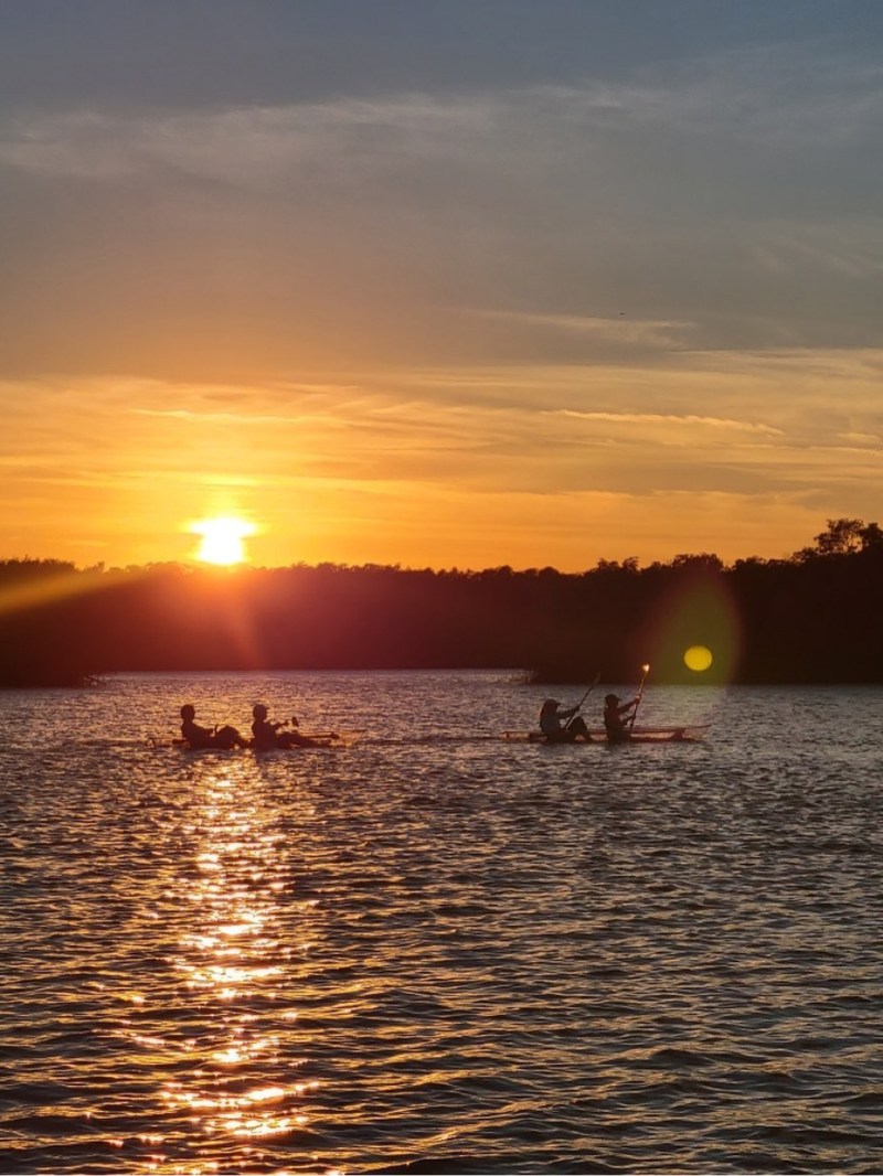 a sunset over a body of water