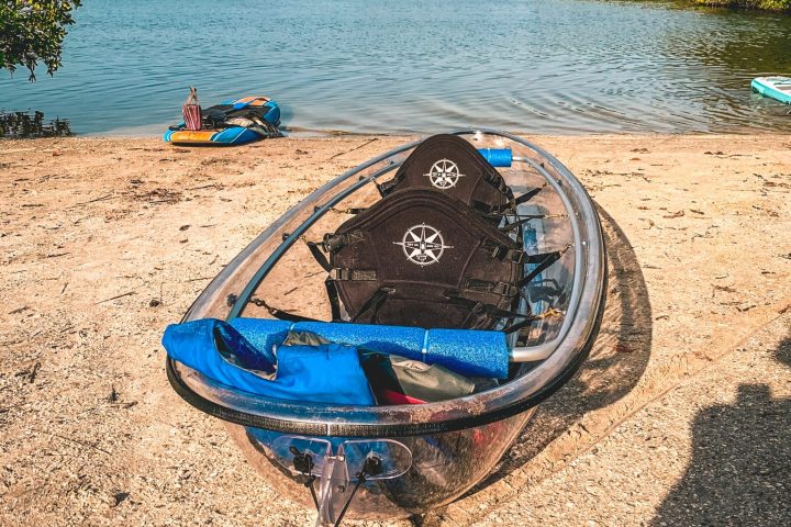 a boat sitting on top of a sandy beach