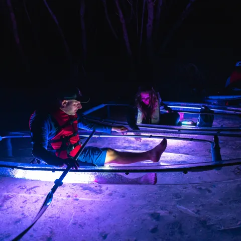 a man sitting in a dark room