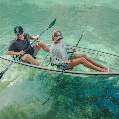 a person riding on the back of a boat in a body of water
