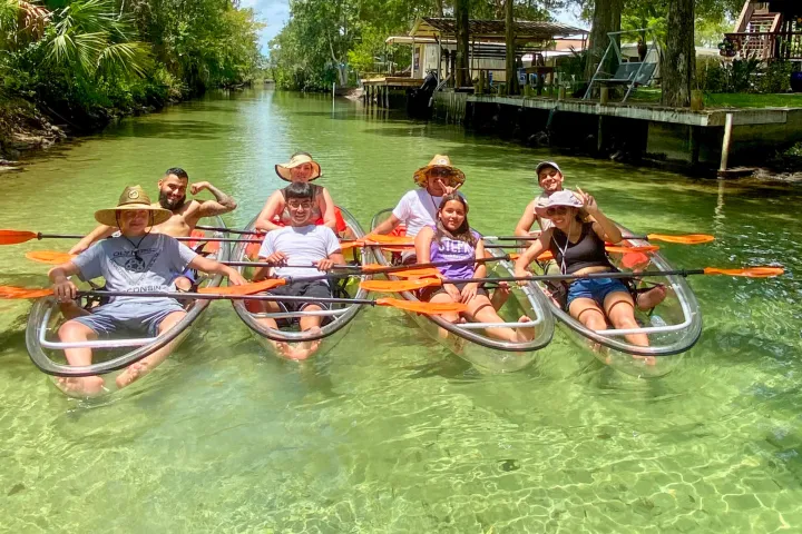 a group of people riding on the back of a boat