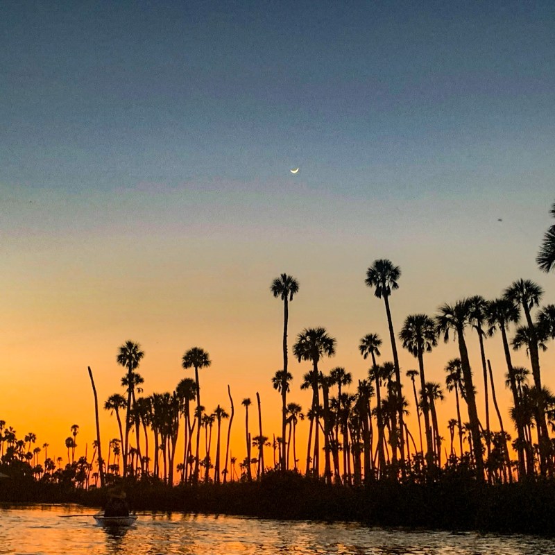 a sunset over a body of water