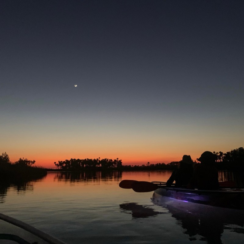 a sunset over a body of water
