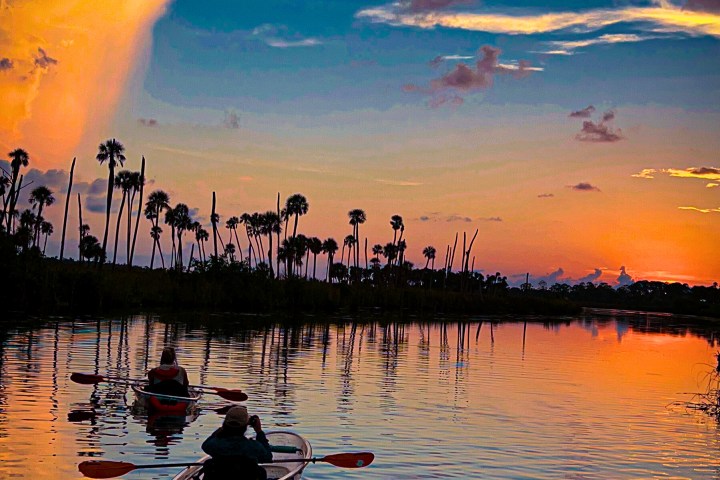 a sunset over a body of water