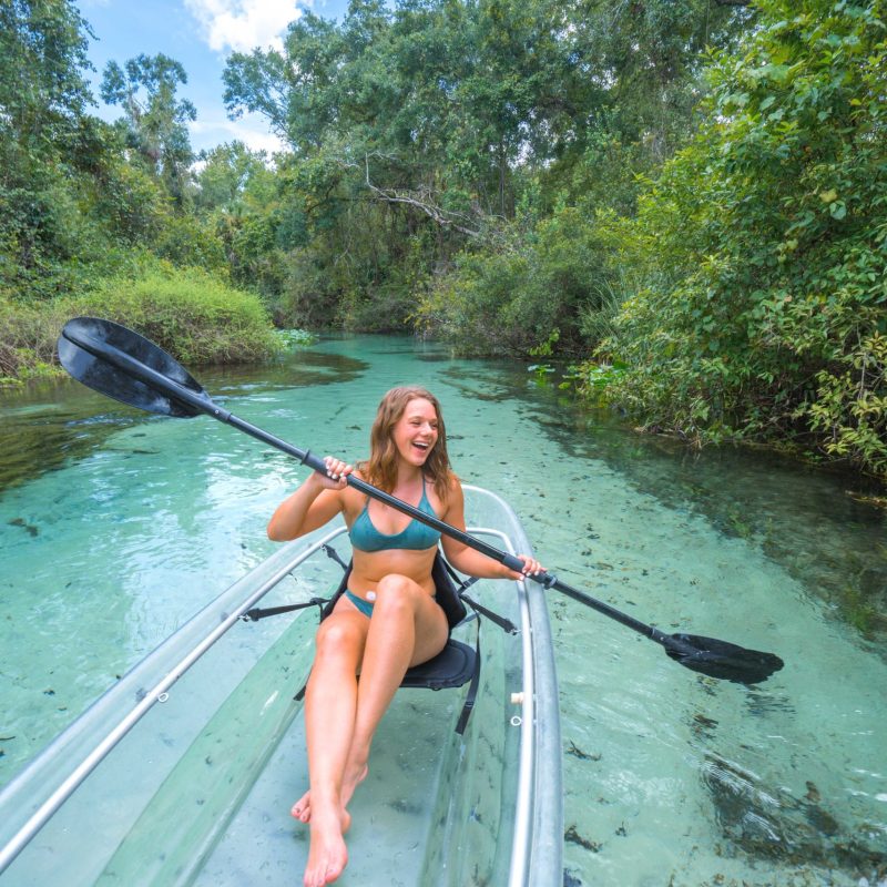 a person standing next to a body of water