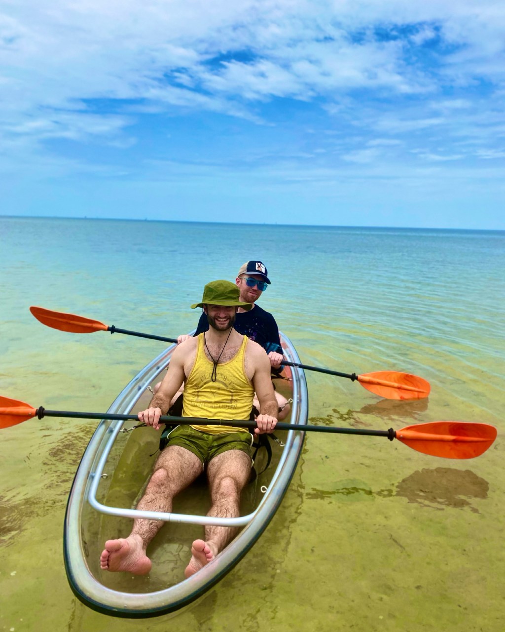 a person standing next to a body of water