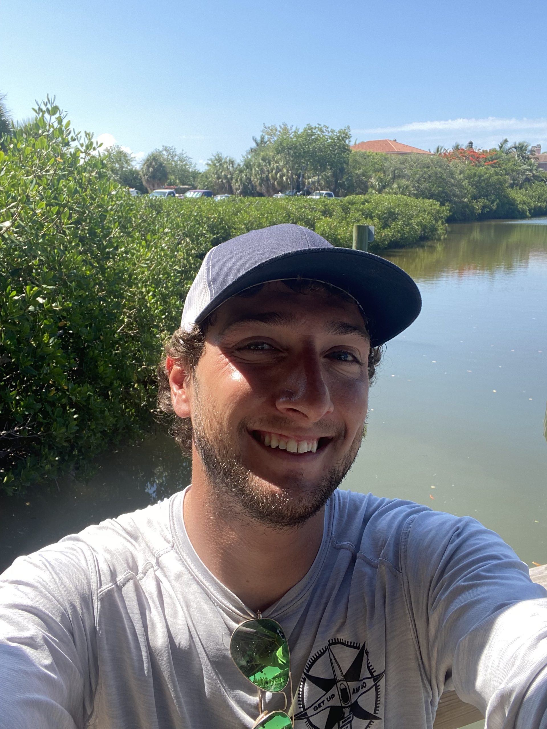 a man holding a fish in the water