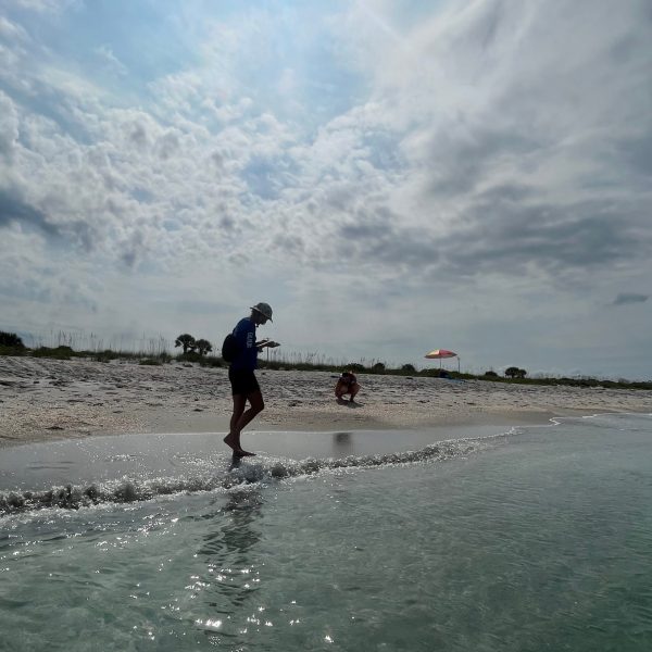 a man riding a wave on a surfboard in the water