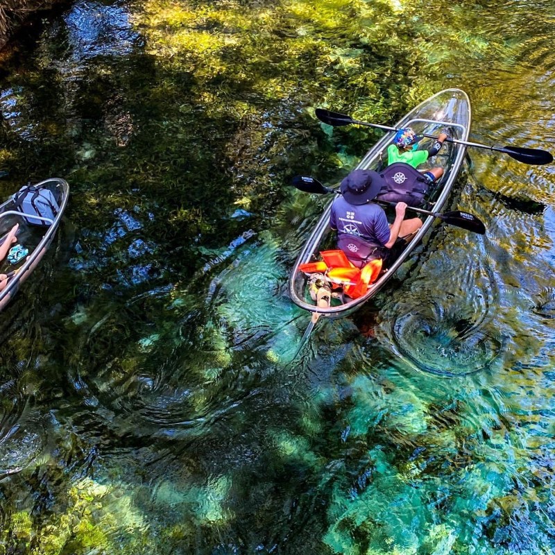 a person riding on the back of a boat