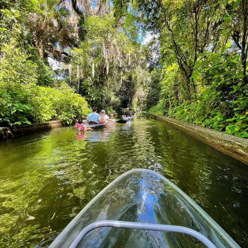 a boat on a river next to a body of water