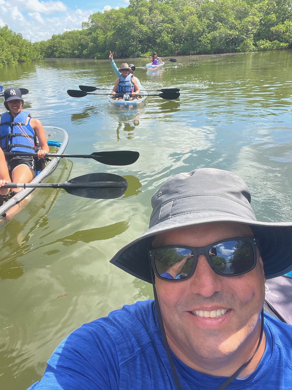 a group of people on a boat in the water