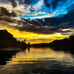 a sunset over a body of water