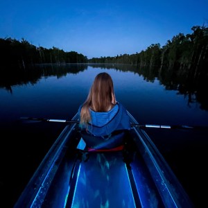 a person standing in front of a body of water
