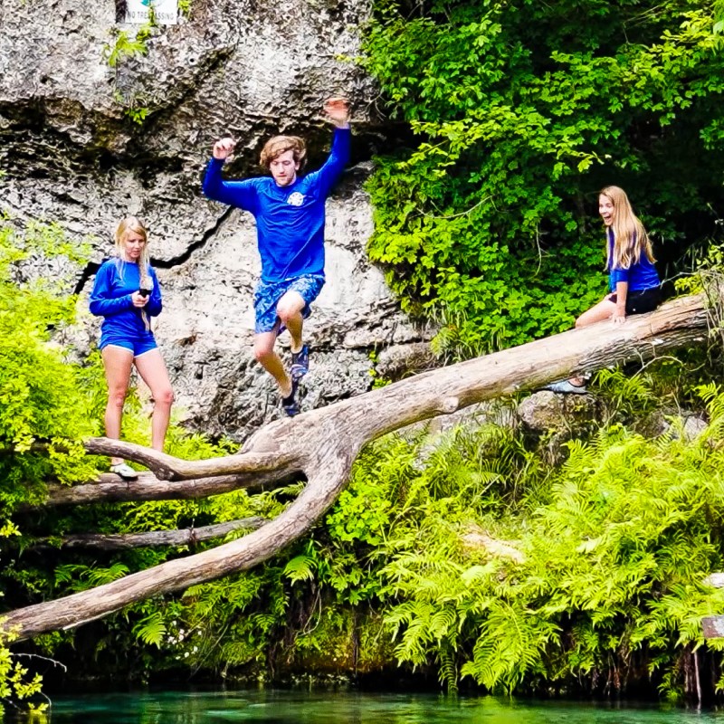 a group of people in blue water