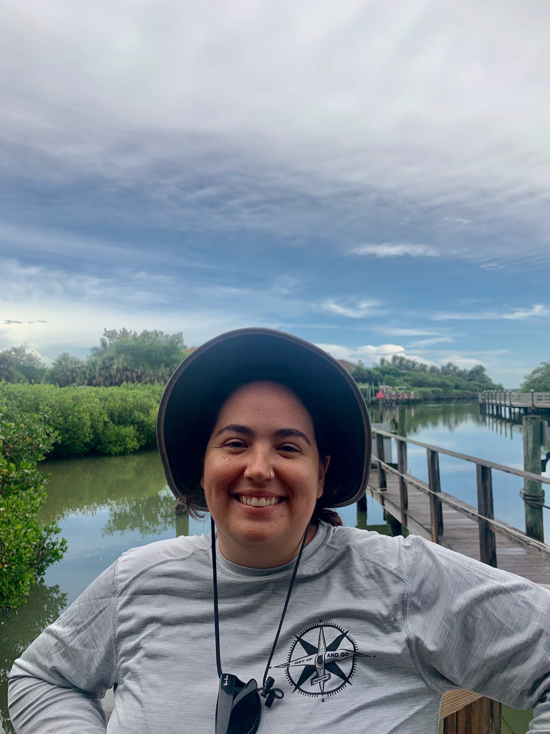 a person standing next to a body of water