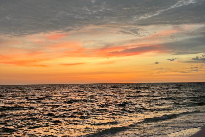 a sunset over a beach