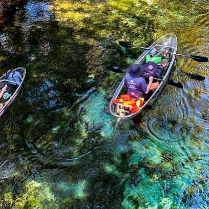 a person riding a skateboard up the side of a river