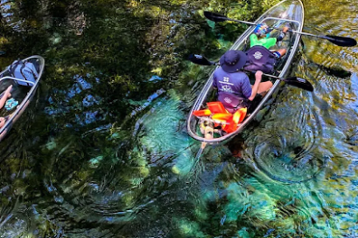 a person riding a skateboard up the side of a river