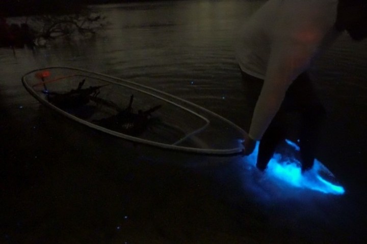 a person that is standing in the dark