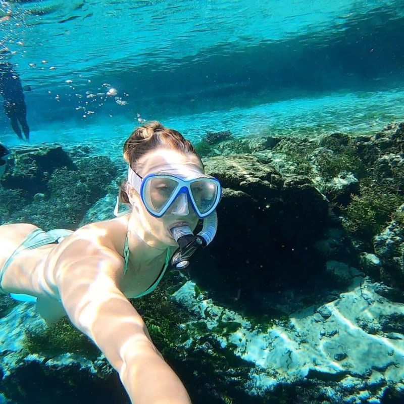a person swimming in a pool of water