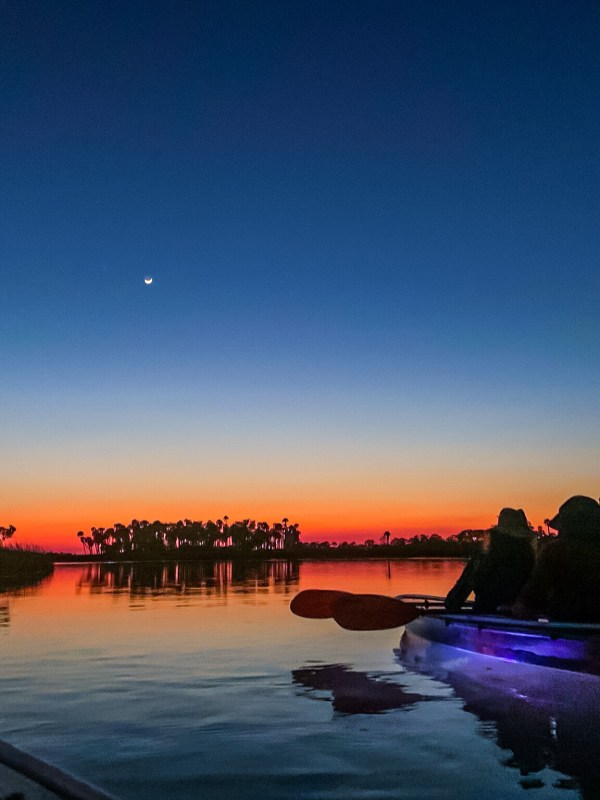 a sunset over a body of water