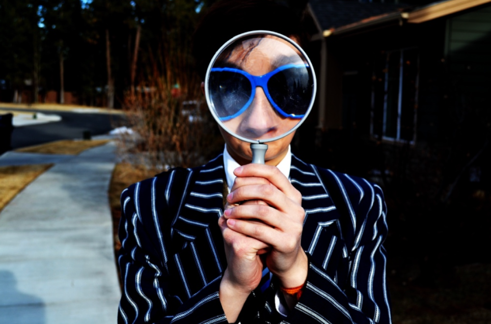 a person wearing sunglasses taking a selfie