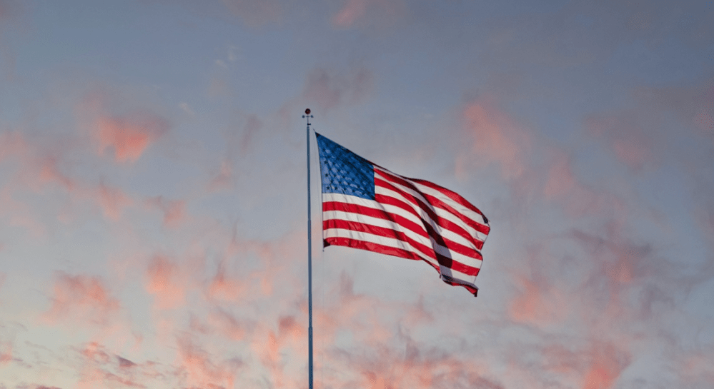 a flag flying on a cloudy day