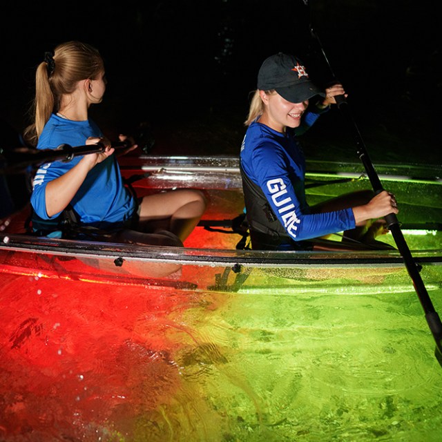 a man rowing a boat in the water