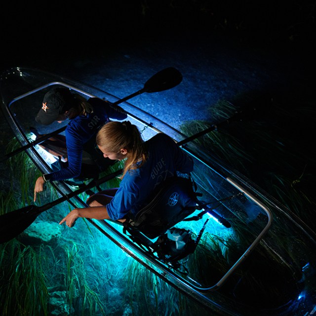 a man sitting in a dark room