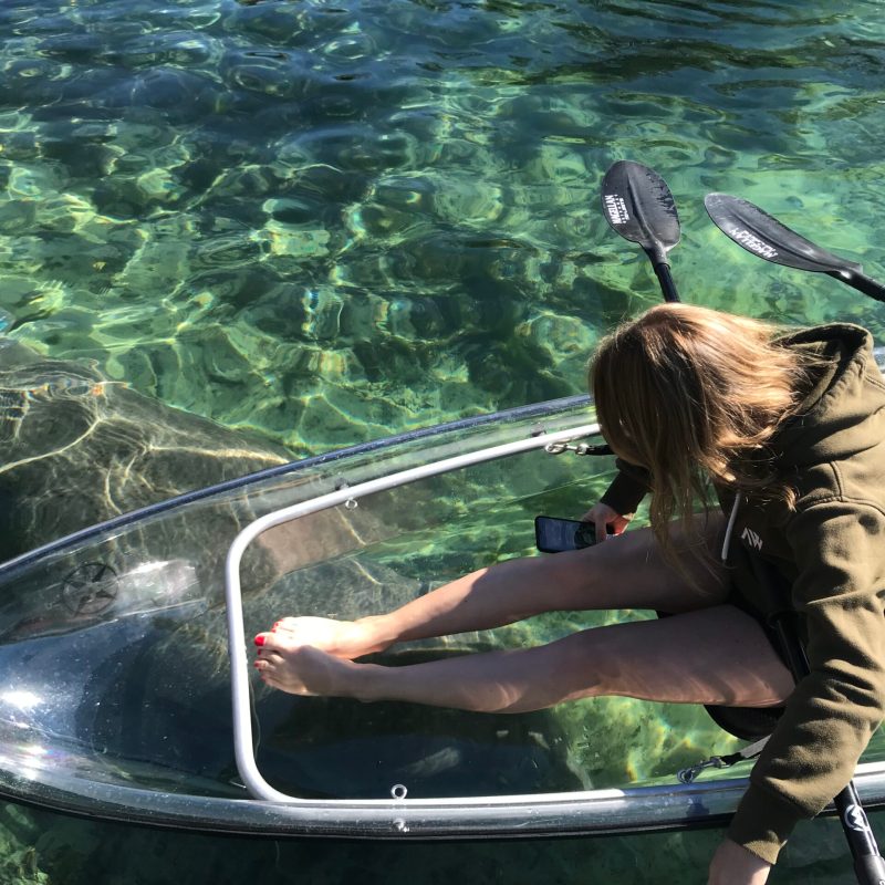 a person sitting on a boat in the water