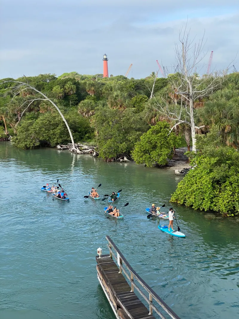 a group of people on a boat in the water
