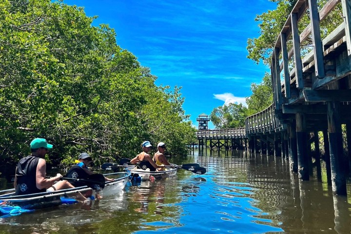 a group of people on a boat in the water