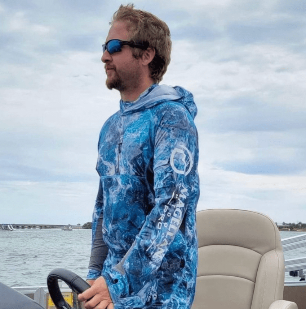 a man standing on a boat in the water