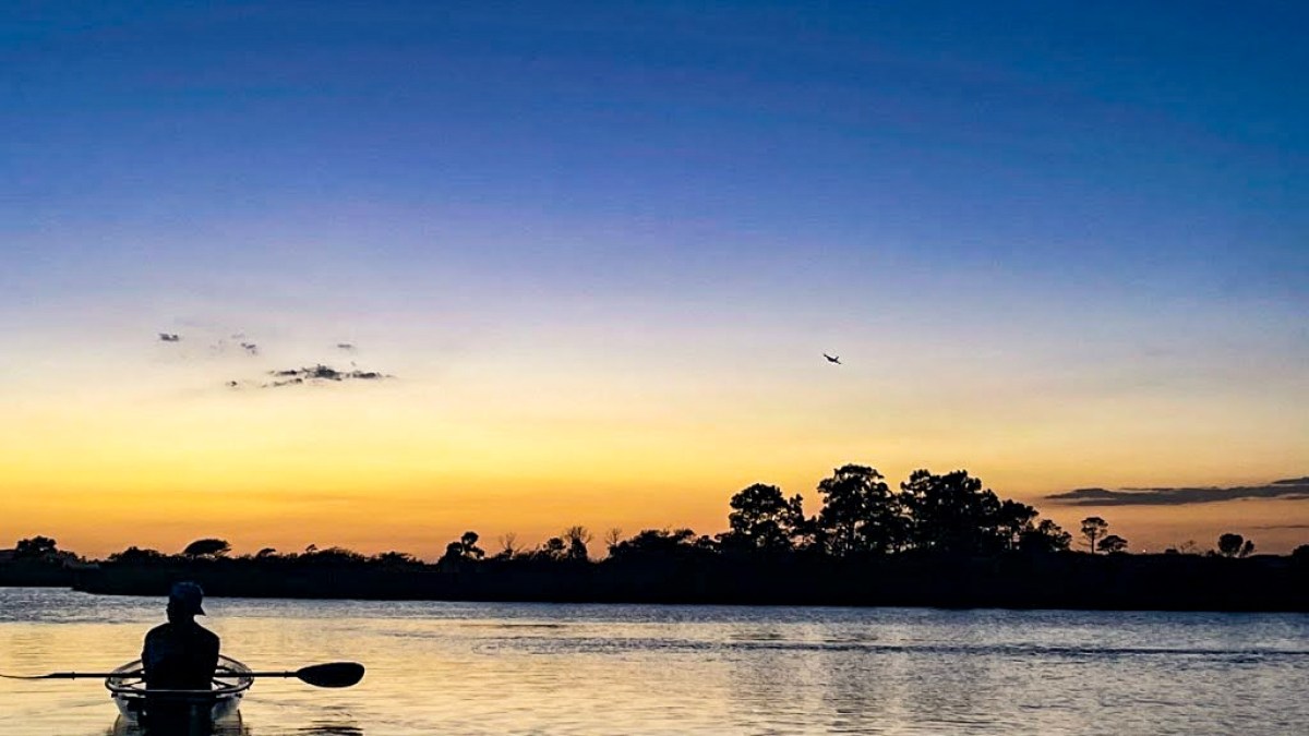 a sunset over a body of water