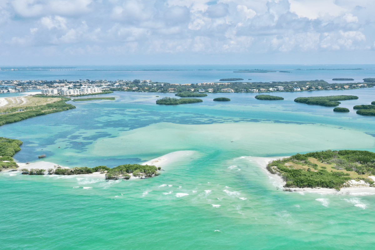 DJI_0197(1) an island in the middle of a body of water