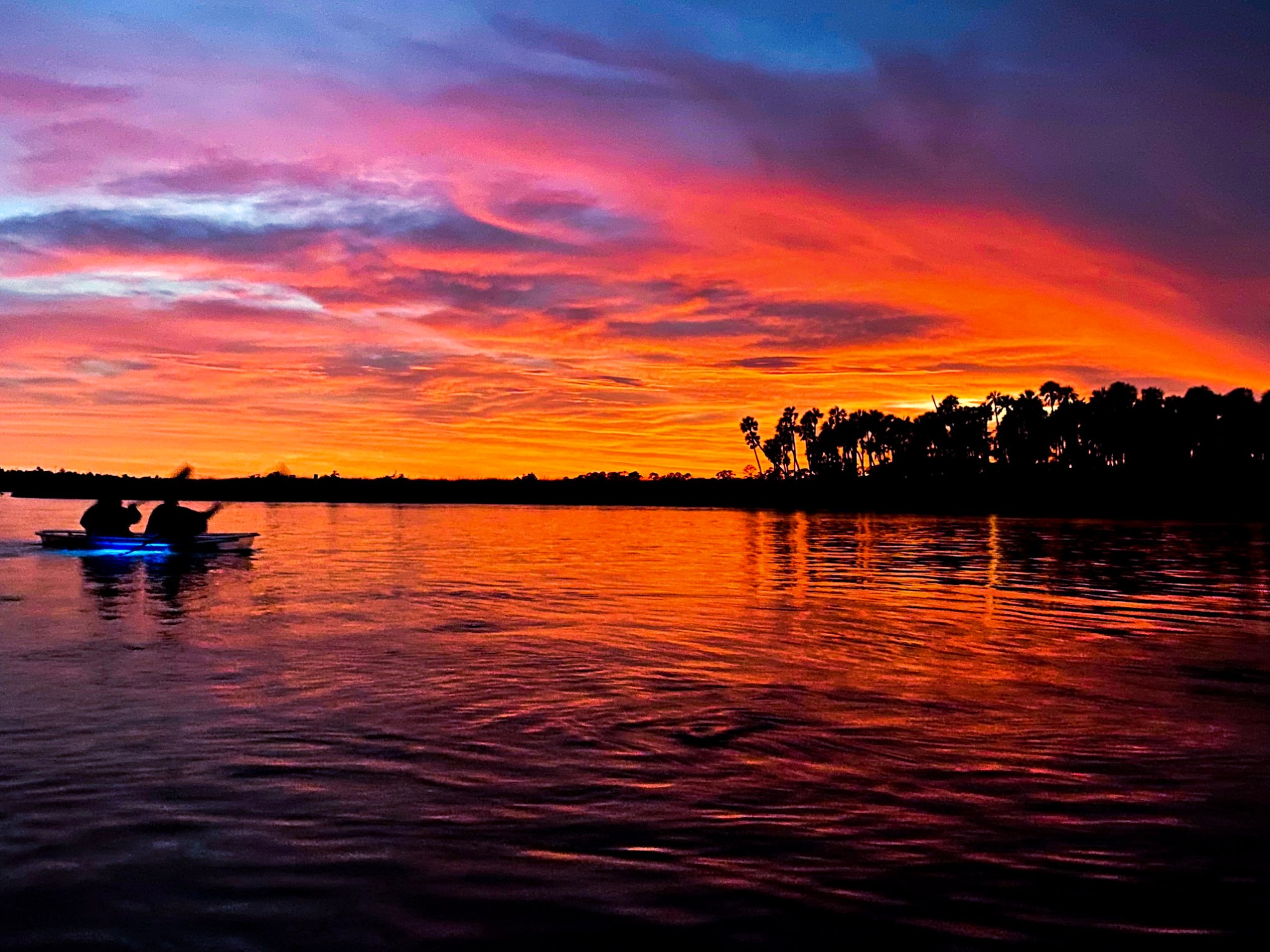 a sunset over a body of water