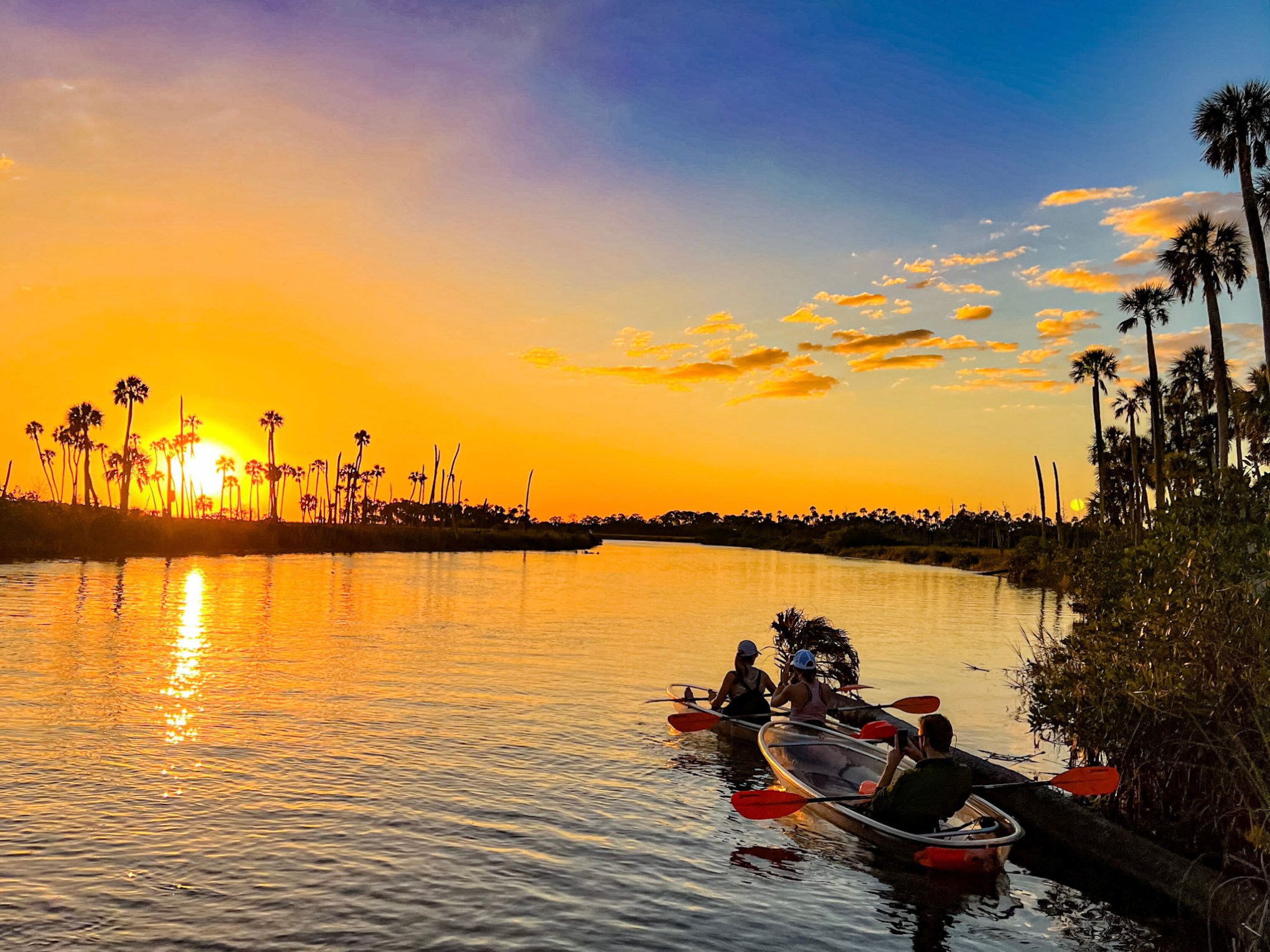 a group of people in a boat on a body of water